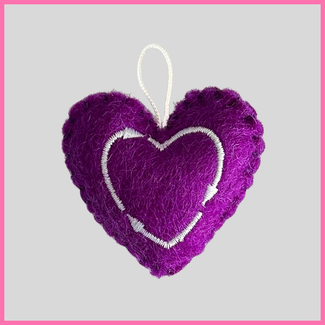 Back of a purple Hope Heart showing The Heart's Intentions heart logo.