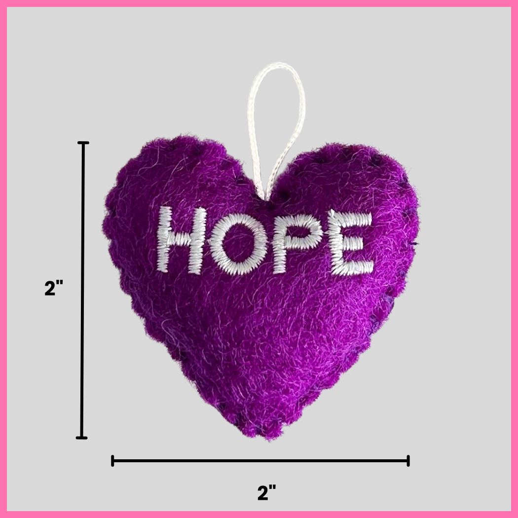 A purple Hope Heart showing its dimensions, two inches by two inches.