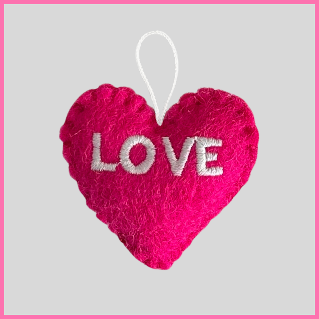 A vibrant pink Love Heart with the word LOVE on it, a meaningful gift to stay connected with the special people in your life and express heartfelt messages like “I love the way you have changed my life in so many beautiful ways!”