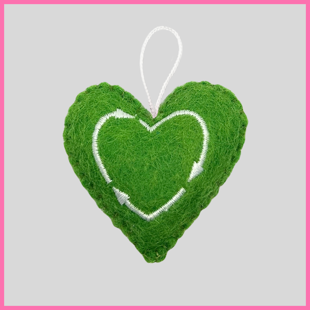 Back of a green Strength Heart showing The Heart's Intentions heart logo.